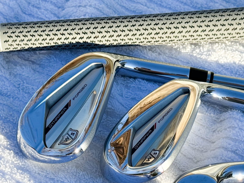 Wilson Dynapower Forged Irons resting on a towel